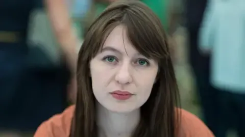 Irish author Sally Rooney claims she will not visit the UK because of legal concerns